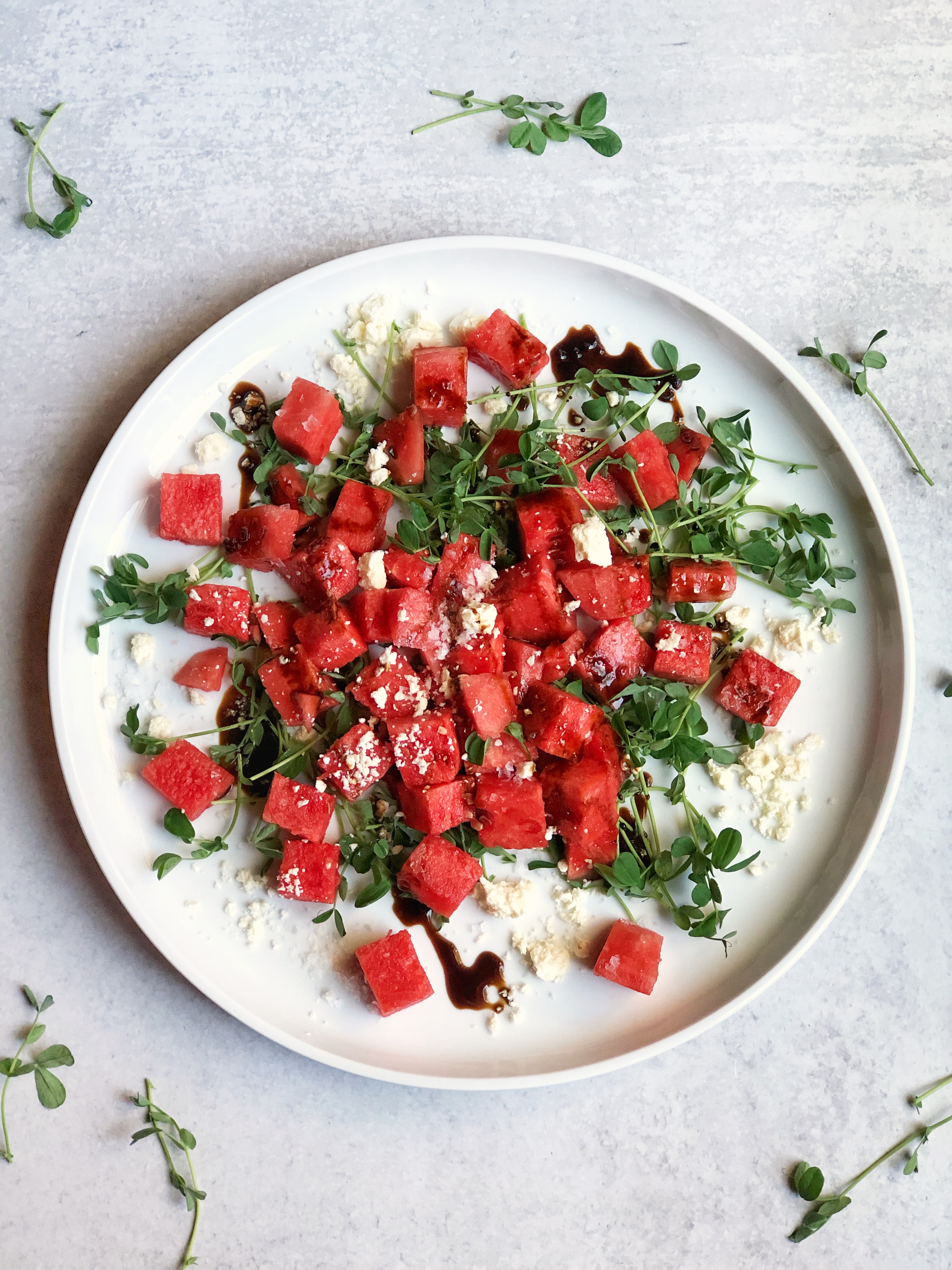 Salted Watermelon Salad with crumbled feta, pea shoots and aged balsamic